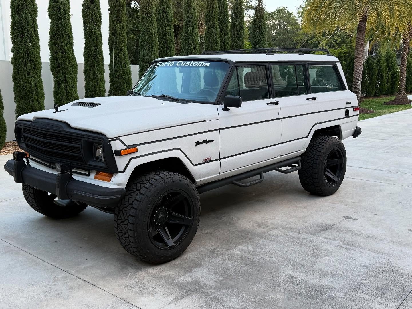SoFlo Resto — The exterior: an old school Jeep Grand Wagoner covered in Pearl White Kevlar Armor - The Interior: all modern Jeep tech including Apple CarPlay, Bluetooth, back up camera, ABS brakes, cold a/c, power windows, traction control, power steering and much more - Under The Hood: 392 Hemi V8 that shuns out 520 raging horses - want one? Contact us today